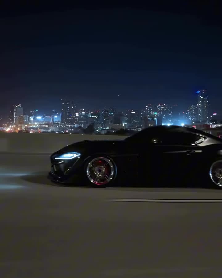 Modified Toyota Supra cruising at night