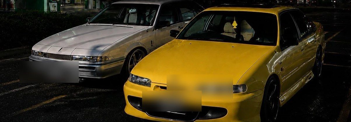 Cars gathered at a night cruise stop